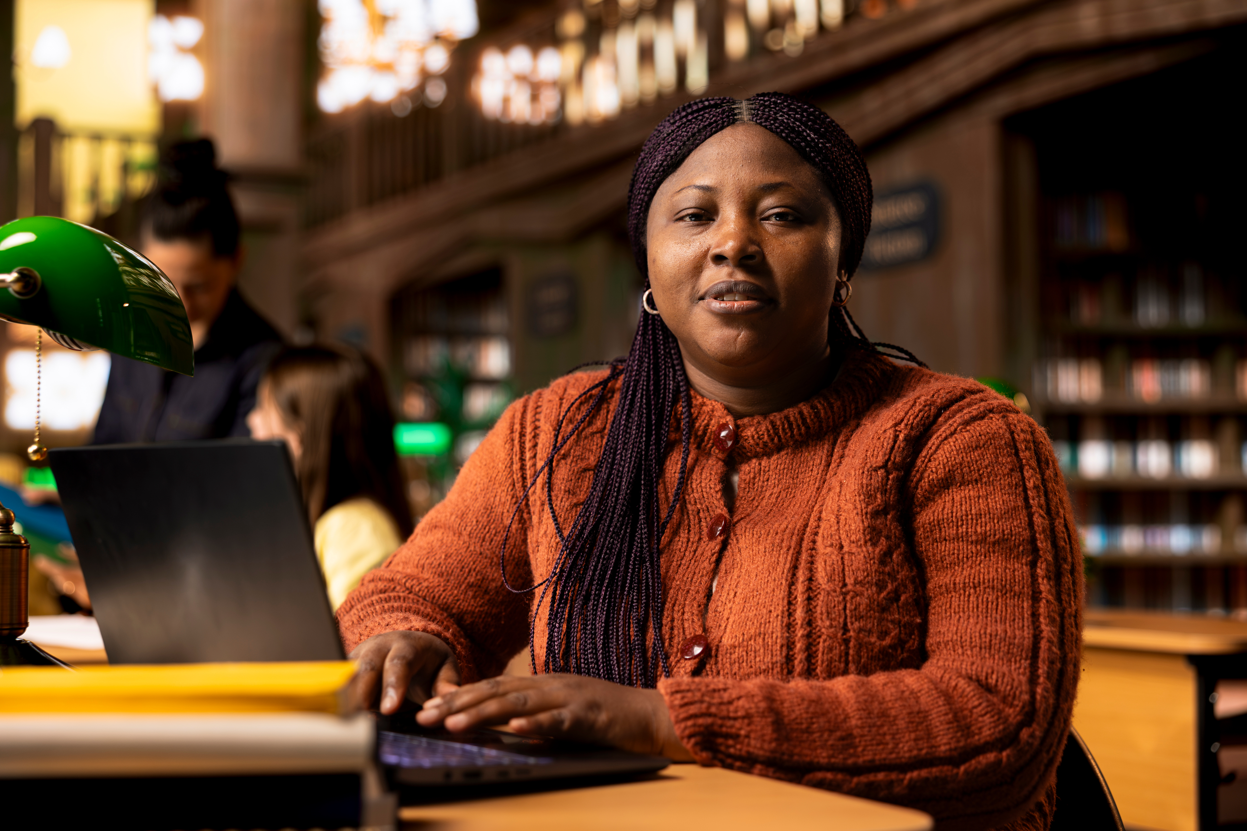 Woman with laptop in study environment